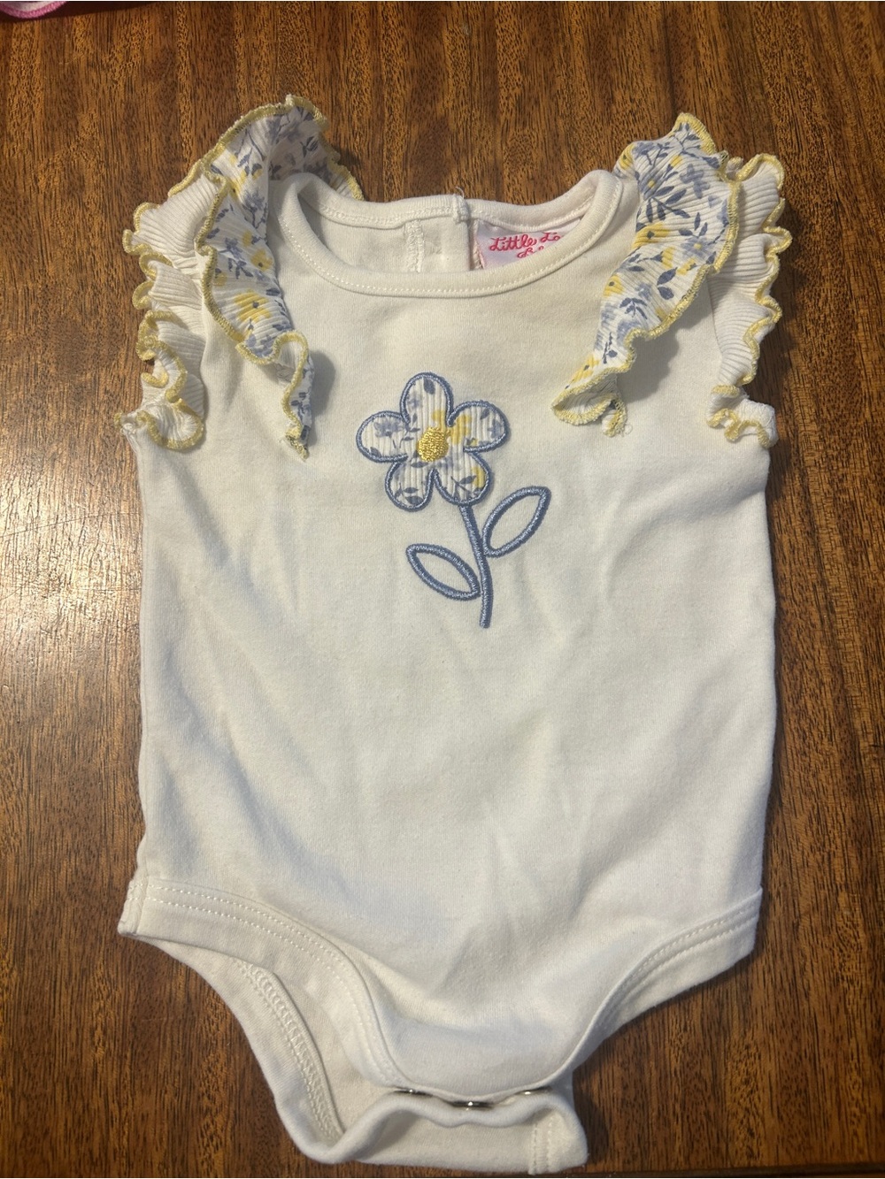 Little Lass White One-Piece with Blue and Yellow Floral Appliqué